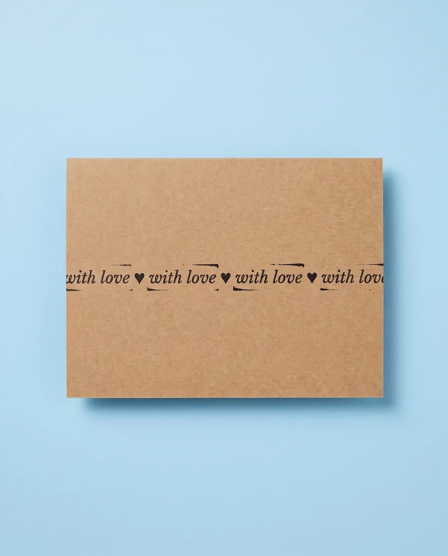 Kraft proof card on light blue: with love repeating on a single 14 mm line, printed with a Rolly M